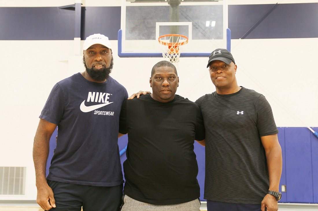 Coaches Steafon Jenkins, James "Pepper" Johnson and Greg Stokes. Photo by Jarleene Almenas