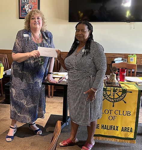 Laurie Kaye, PCHA President, presents a check to Janet Bryant, executive director of the Rose Marie Bryon Children’s Center. Courtesy photo