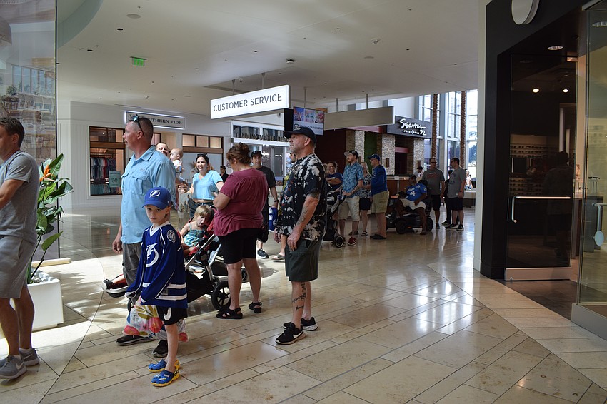 Families get in line to meet former Tampa Bay Buccaneers and Tampa Bay Lightning players.