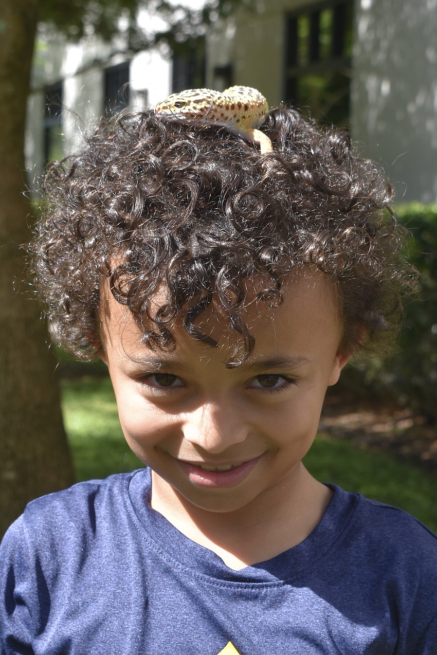 Paxton Bridges, 8, and his leopard gecko Bodhi.