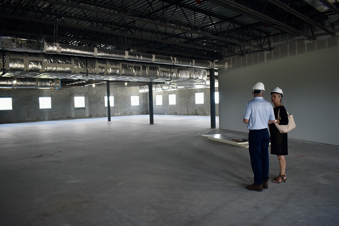 David Sessions, CEO of Willis Smith Construction, talks with former county commissioner Vanessa Baugh on the second floor back in May 2023 when the focus was still on finishing the first floor.