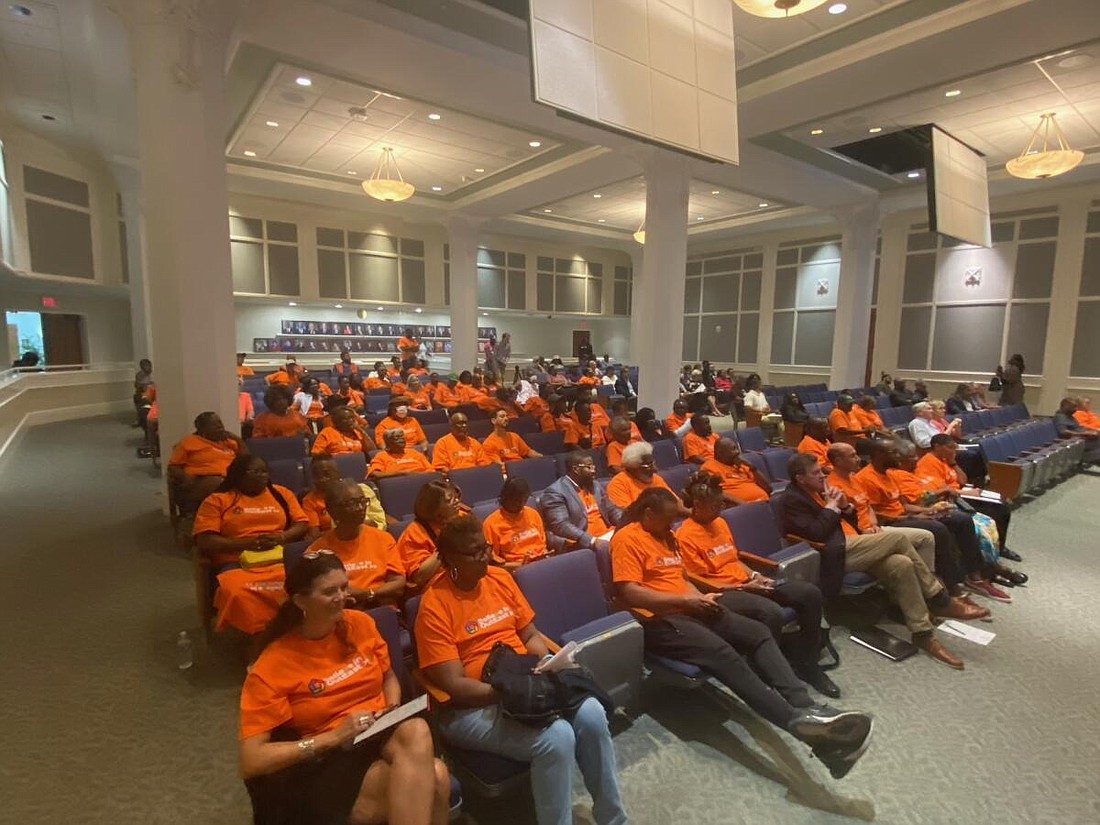 Residents of OutEast, the neighborhood north of EverBank Stadium, gather at City Hall on June 17 for a City Council meeting about the Jacksonville Jaguars "Stadium of the Future" agreement. Their shirts read "Believe in OutEast."