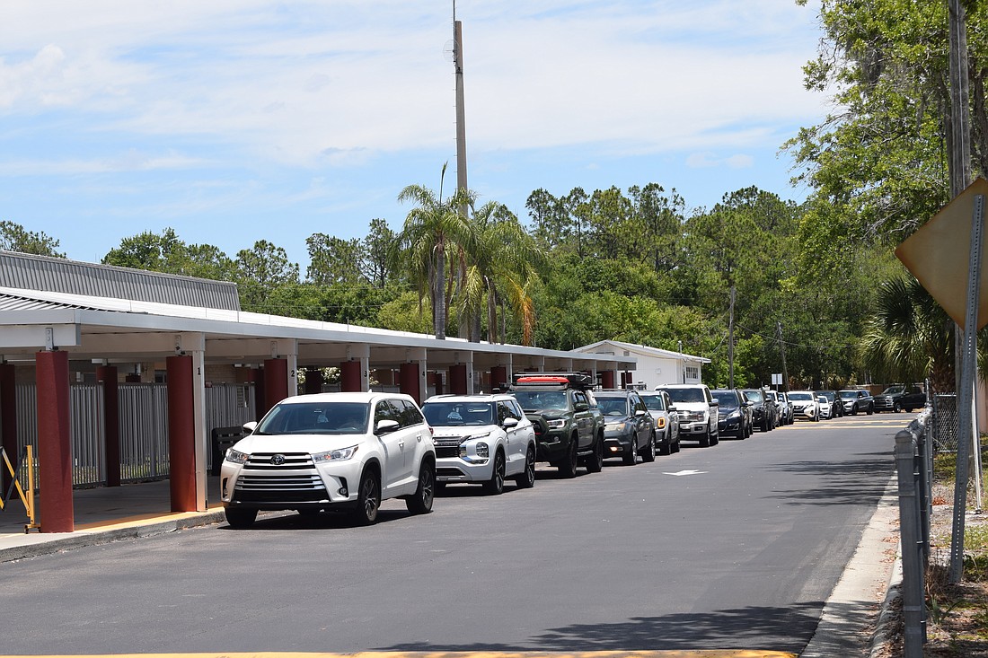 Parents wait in their cars for dismissal at Braden River Elementary School.