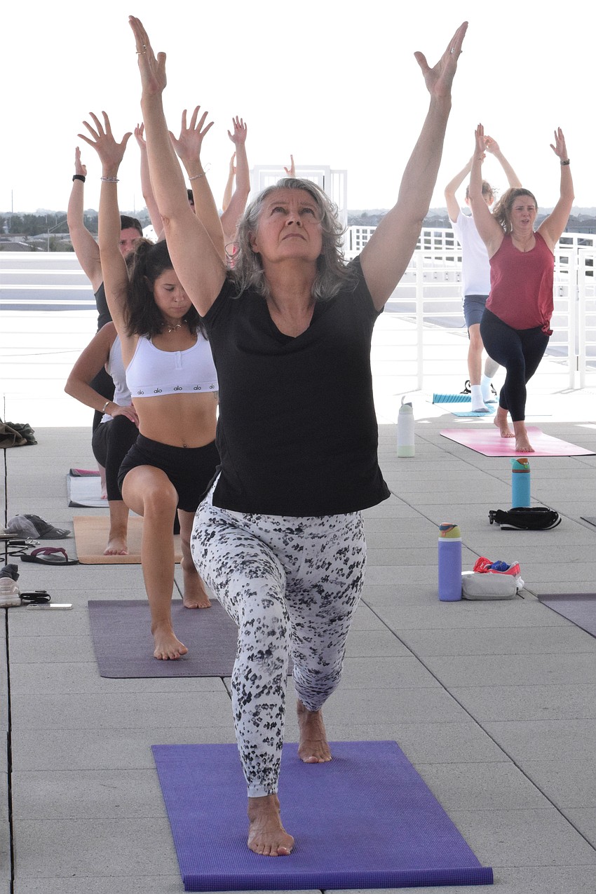 Jan Morris enjoys Rooftop Yoga at the Lakewood Ranch Library. She was among 18 people participating in the class.