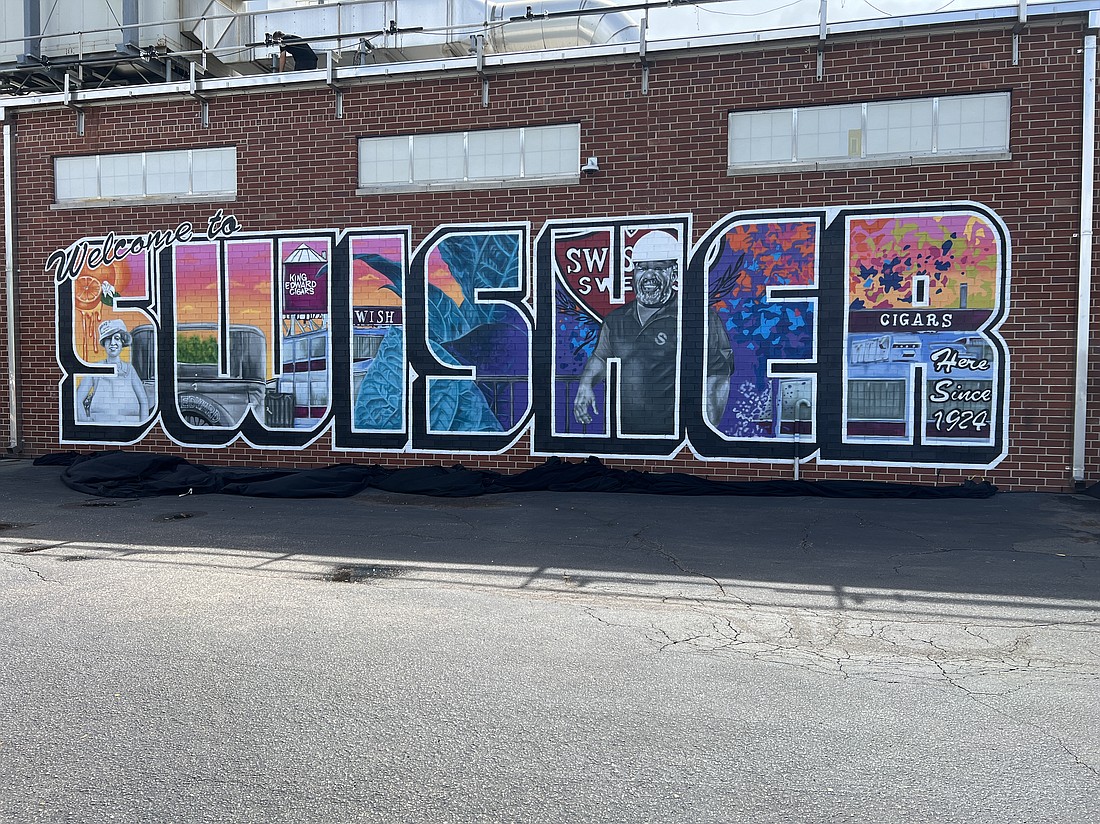 Swisher marked its 100th anniversary in Jacksonville on June 20 with the unveiling of a mural at the entrance to its corporate headquarters.