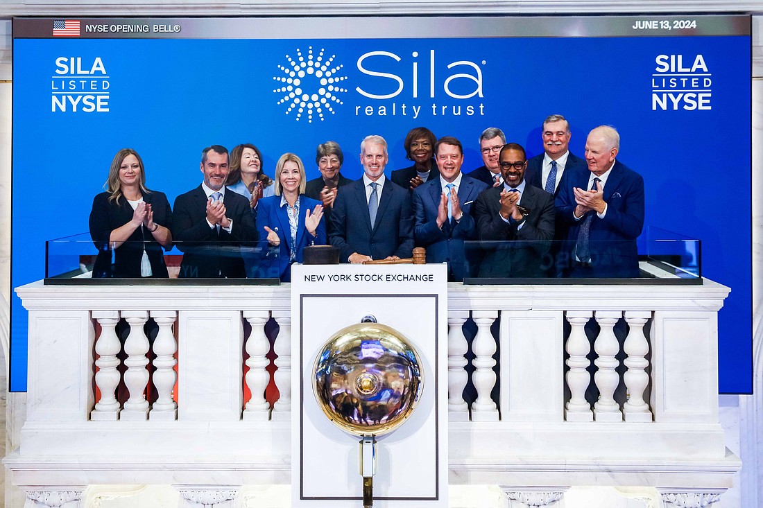 Sila Realty Trust executives and board members ring the opening bell at the New York Stock Exchange on June 13, 2024.