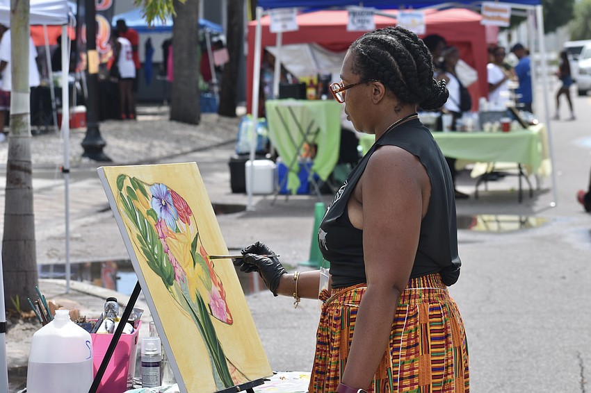 Sheebe Msanii creates a painting.