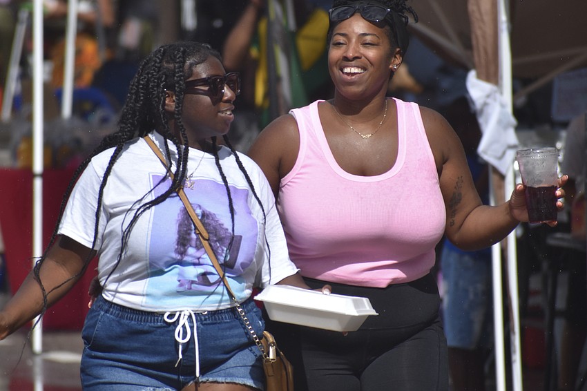 Melena McTiller and her mother Marie Torres enjoy the party.