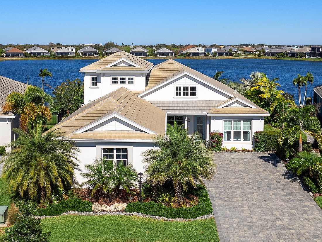 This Lakehouse Cove at Waterside home at 8088 Grande Shores Drive sold for $2.05 million. It has three bedrooms, three-and-a-half baths, a pool and 3,674 square feet of living area.