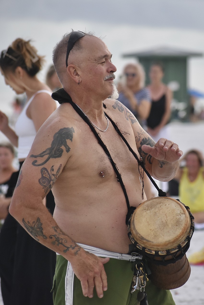 Andrew Brown-Clark walks the circle as he drums.