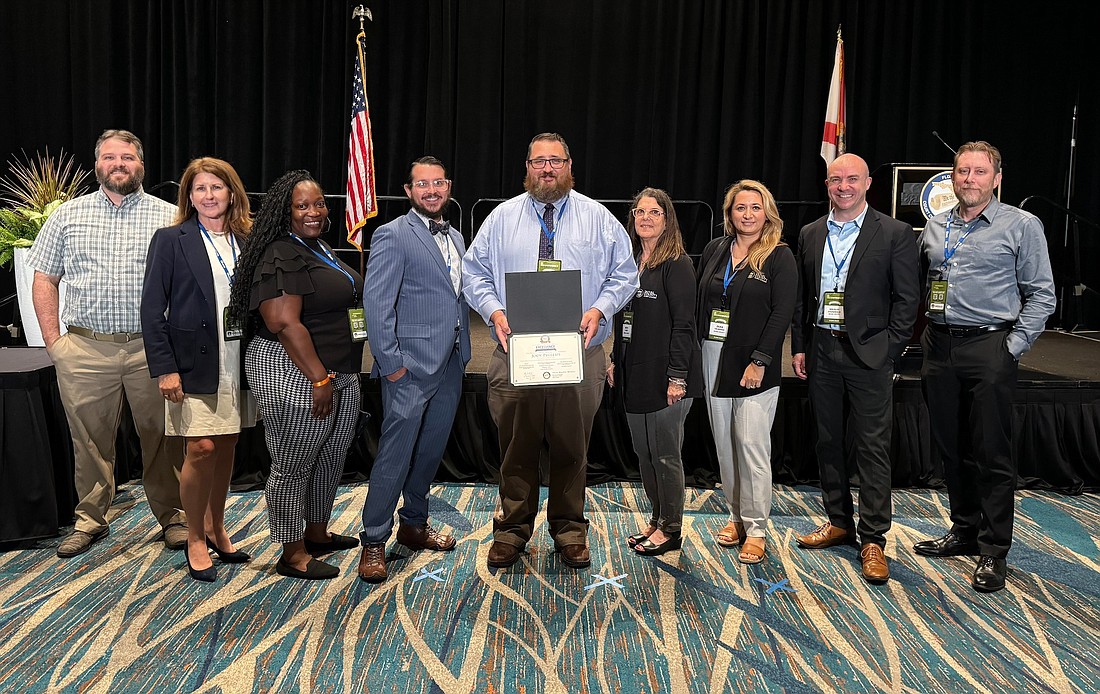 The Duval Clerk of Courts received the Best Practices Recognition of Excellence from the Florida Clerk of Courts & Comptrollers. Above, the Duval delegation that accepted the award June 19 in Orlando, from left: Josiah Monks, Beth Dickson, Shannon Major, Justin Portlock, Chris Douglas, Beth Fleet, Zilka Celikovic, Douglas Fitzgerald and Jonathan Ard.