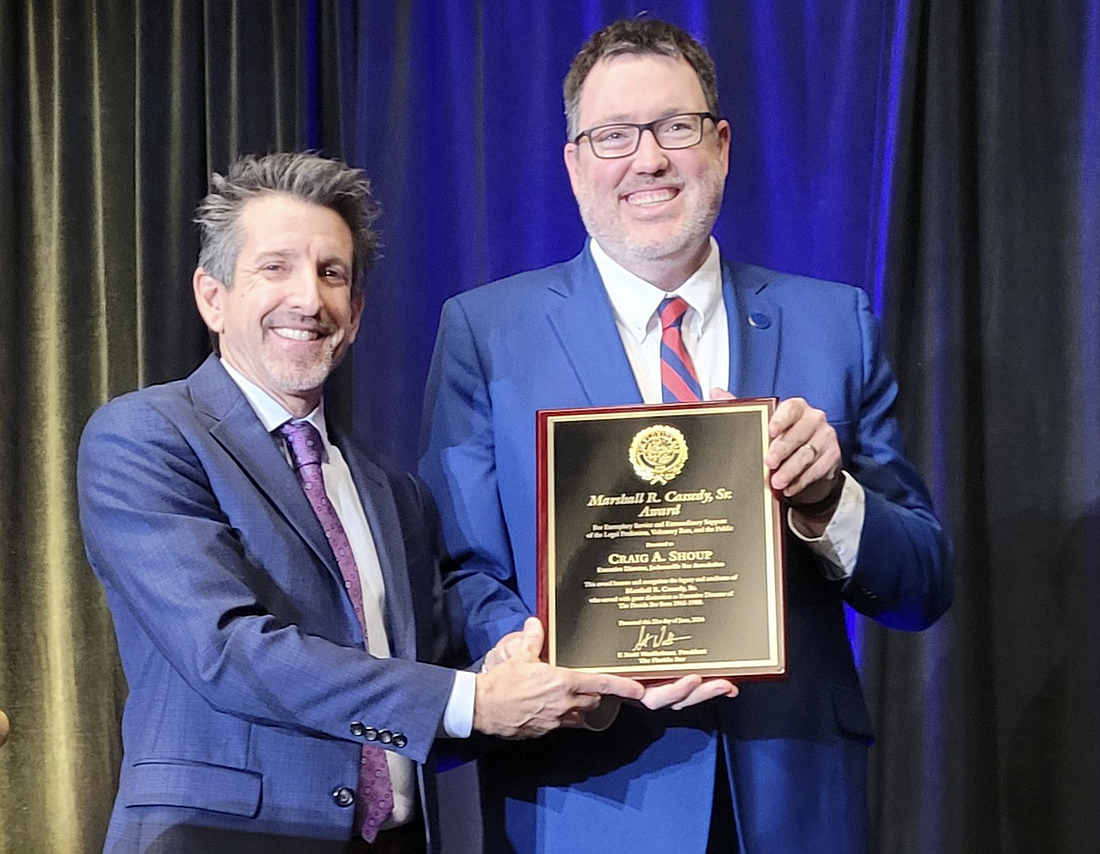The Florida Bar 2023-24 President Scott Westheimer, left, presented the 2024 Marshall R. Cassedy Sr. Award to Craig Shoup, Jacksonville Bar Association executive director, at the Bar’s meeting June 21 in Orlando.