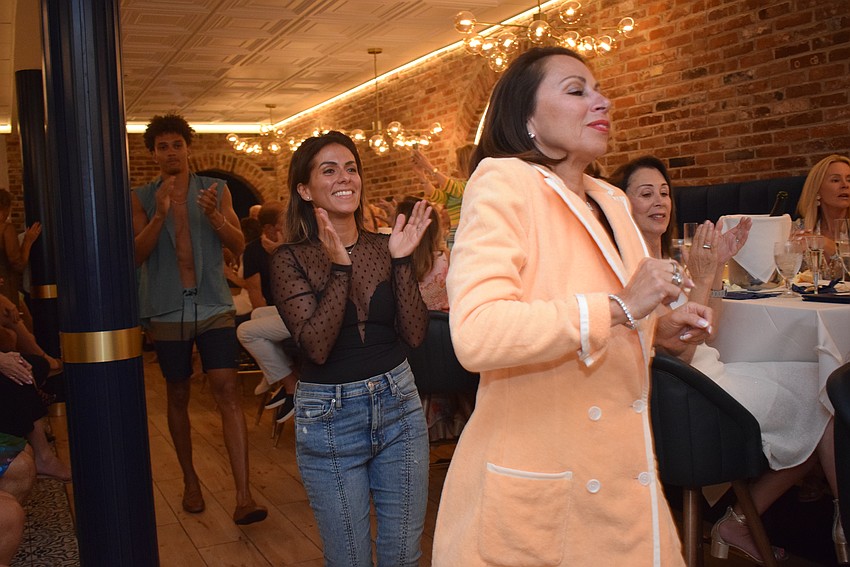 Tatyana Sharoubim-Stewart and models KJ and Rita ending the show