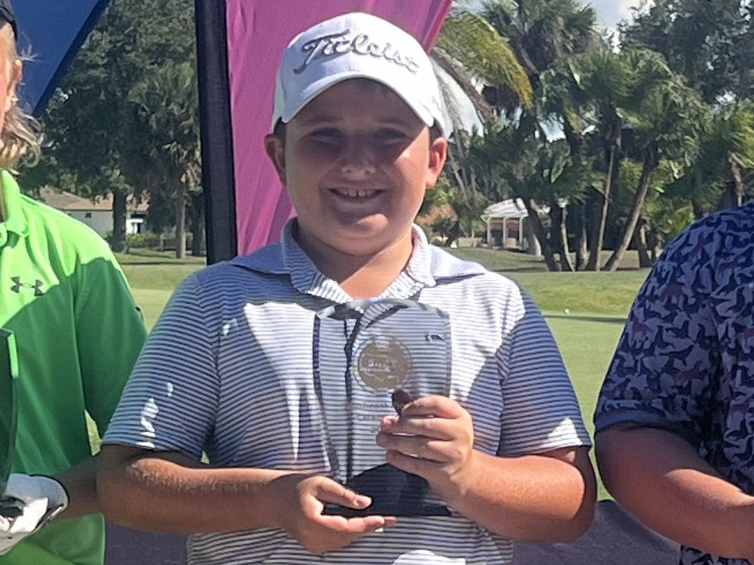 Lakewood Ranch Country Club's Graham Gapin poses with the trophy from winning the Boys 10 division of the 2024 Southeast Florida State Invitational at nine under par (68-67—135).