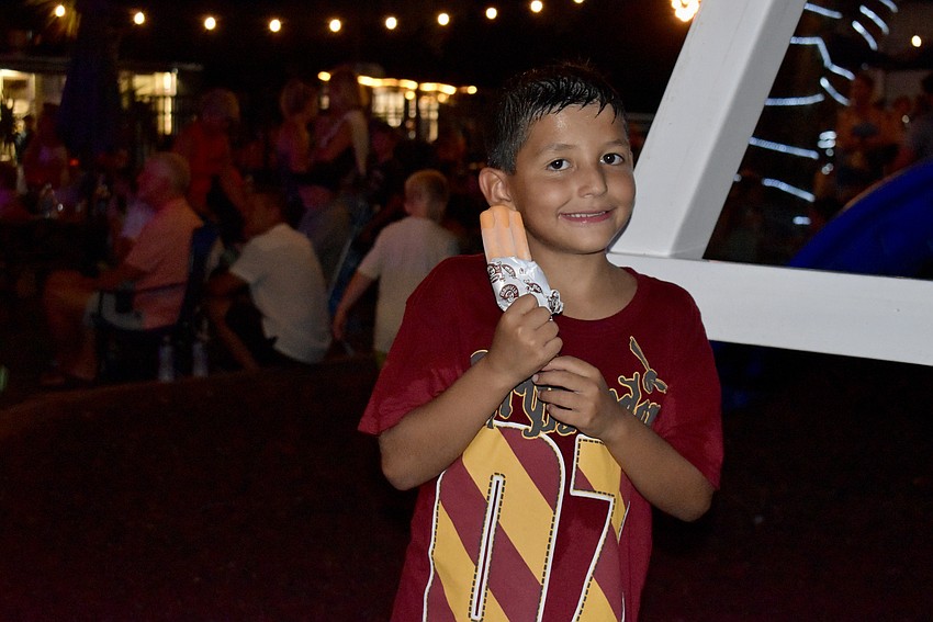 Jacob Smith, 9, cools down on the playground with a creamsicle.