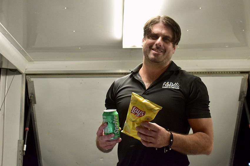 Daniel White takes his first pause after four hours of working in the Fiorelli food truck. The only items left for sale are hot dogs, sodas and chips. Everything else is sold out.