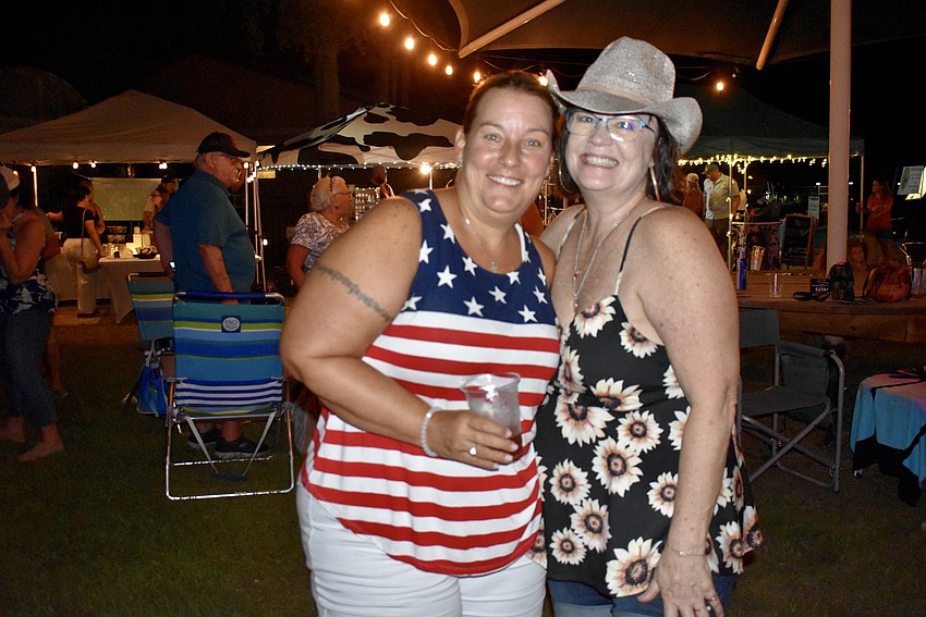 Ellenton resident Jennifer Yelton and Bradenton resident April Pyle enjoy Yelton's first Red, White and Blueberry Festival. She just moved from Kentucky.
