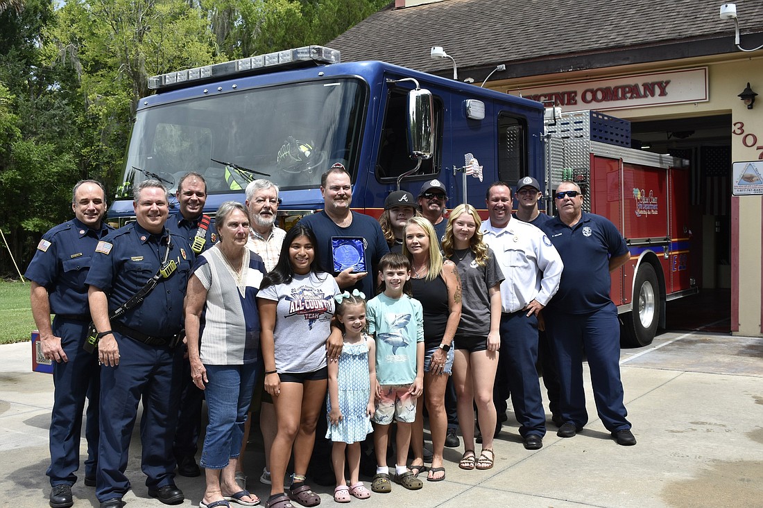 Lieutenant John Peacock, center, with his family after being recognized for 25 years of service to the Palm Coast Fire Department. Courtesy photo