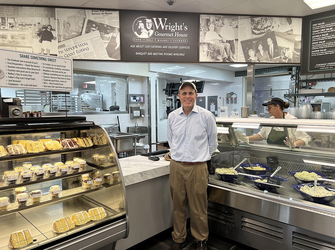 Jeff Mount, owner of Wright's Gourmet House 1981-2024, poses at the to-go counter.