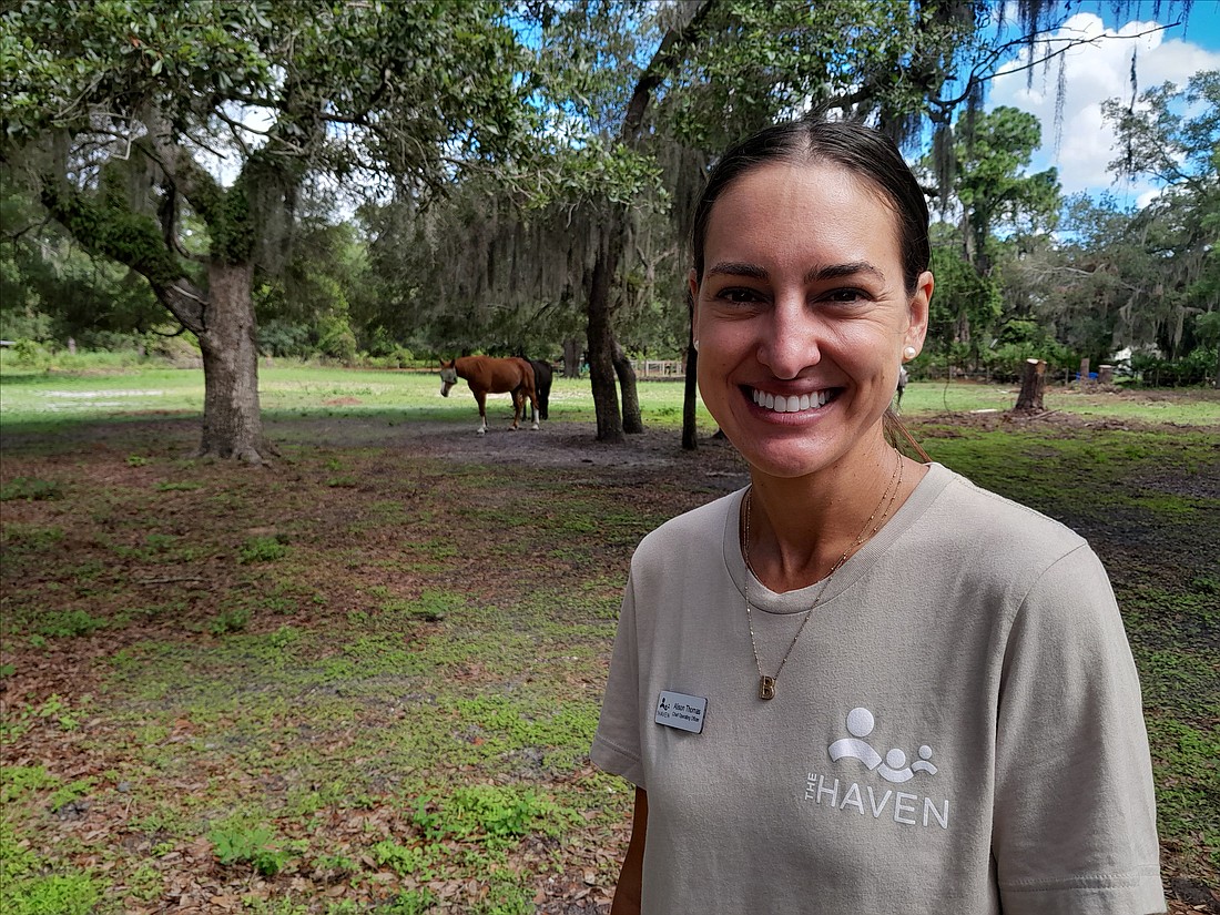 The Haven COO Alison Thomas stands at the parcel of land on Desoto Road that was just purchased by The Haven to offer supported/independent living.