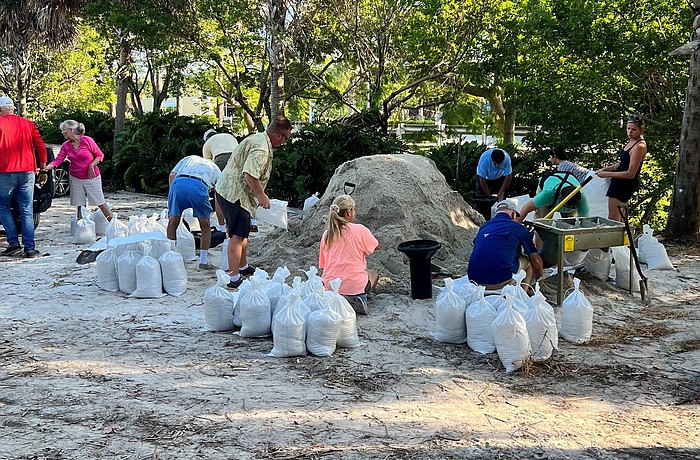 Residents gather sandbags on Longboat Key before Hurricane Ian.