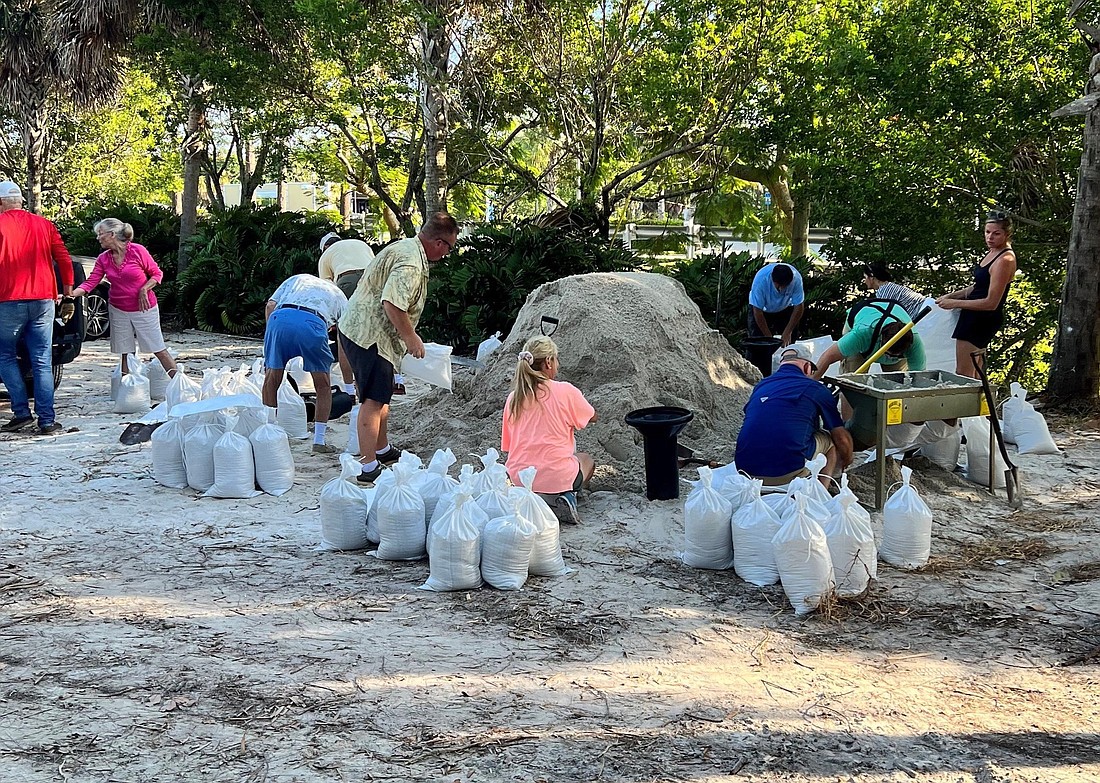 Residents gather sandbags on Longboat Key before Hurricane Ian.