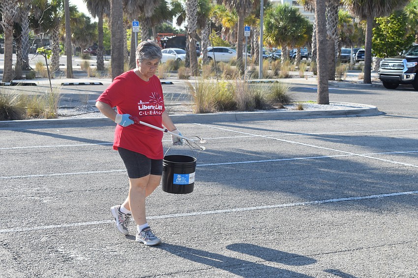 Maria Shay searches the parking lot.