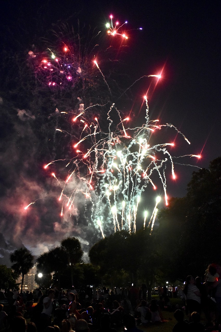 The crowds enjoy the fireworks.