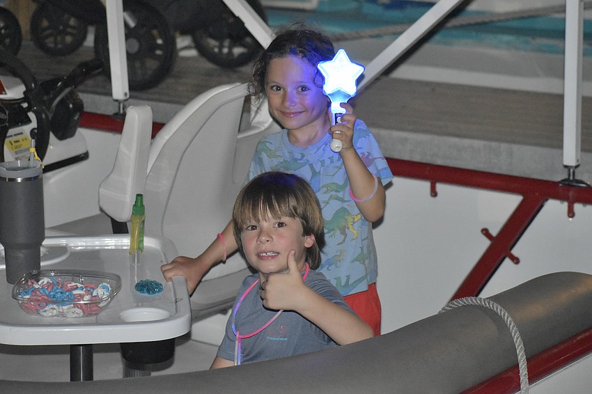 Alden DiBitetto, 6, and Charles Scherer, 6, enjoyed the fireworks by boat, with their families.