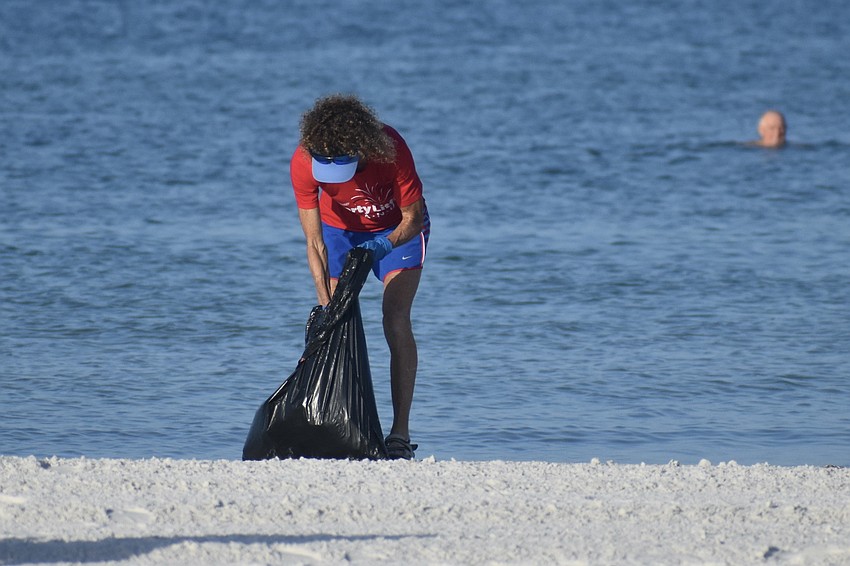 Colleen Redmond cleans up near the water.