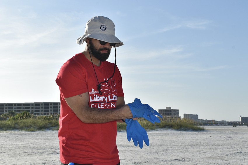 Craig Burnett puts on his gloves.