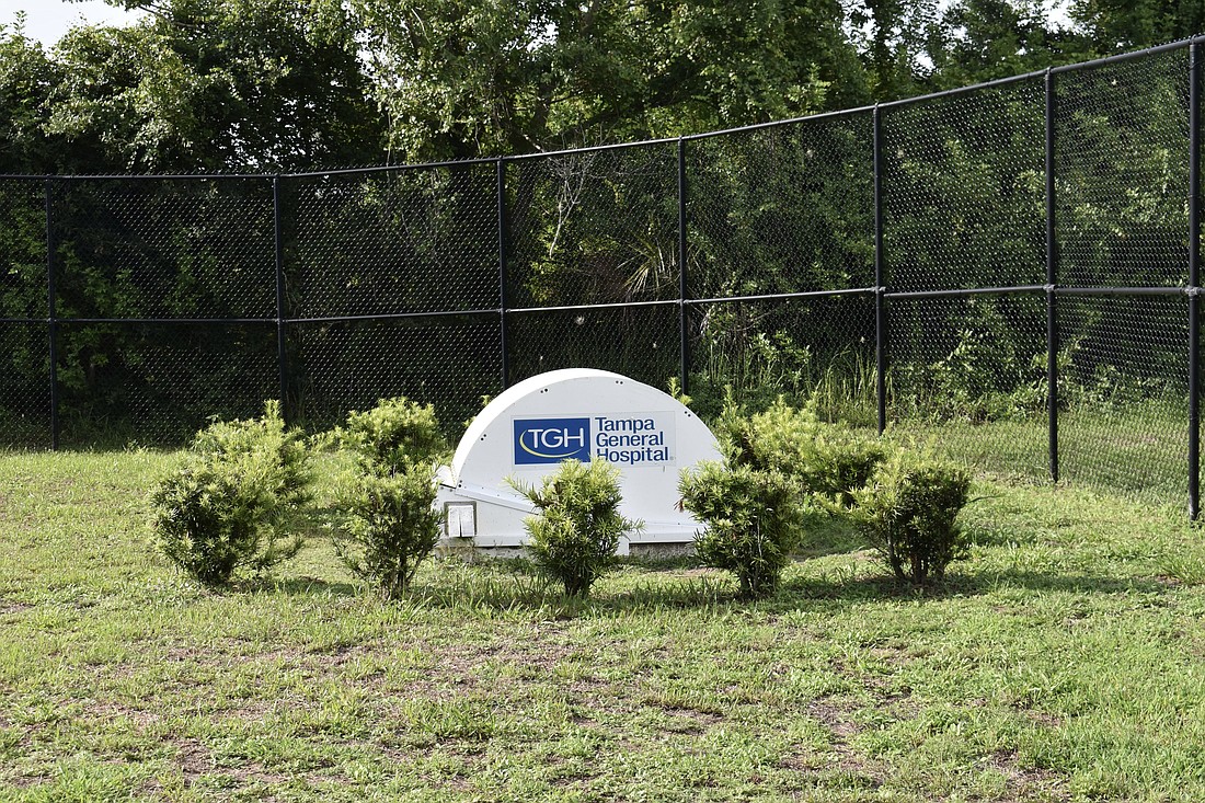 The drone sits inside a ground hub, ready to deploy, in the side yard of the Lakewood Ranch EMS station.