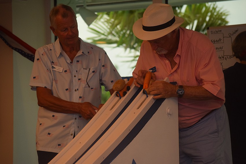 Phil Rosenbaum carefully angles his potato car.
