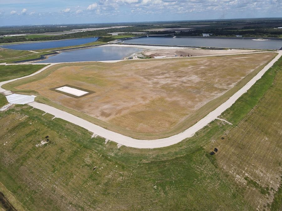 A protective liner has been installed on top of the south Phosphogypsum stacks at Piney Point. It includes a new stormwater control system, and soil cover and grass to reduce the chance of soil erosion.