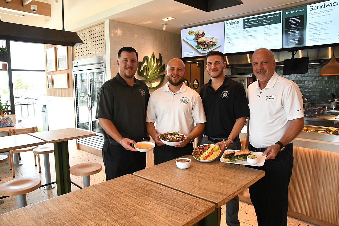 Sizzlin’ Greens partners are five members of the Holden family: Stephen, left, Ryan, Jason, Ray and, not pictured, Kyle Holden. Menu items include Broccoli Cheddar Soup, Minestrone Soup, Summer Salad with Chicken, Cobb Salad with Shrimp and a Chimichurri Steak Sandwich.