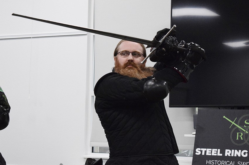 Jason Callis, the founder and owner of Steel Ring Academy, is in the ox guard stance.