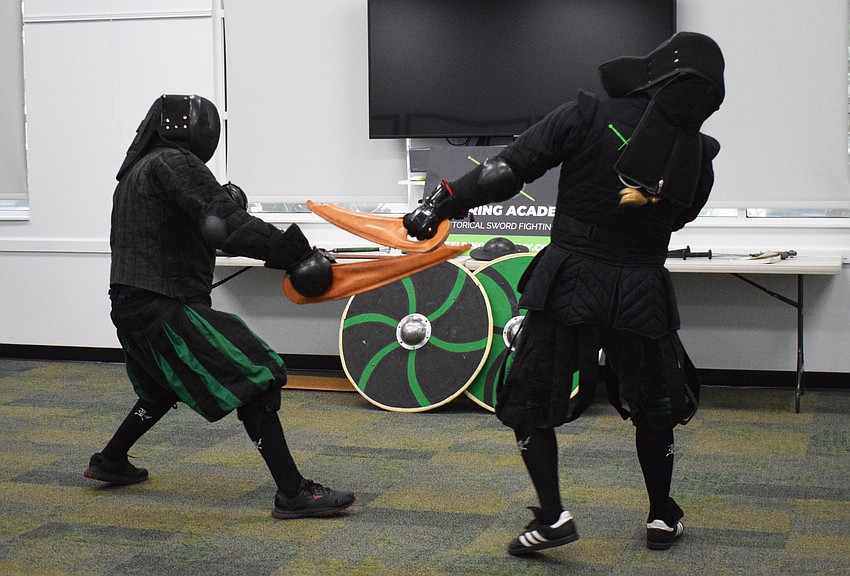 Chris Fontana, a junior instructor for Steel Ring Academy, fights Jason Callis, the owner and founder, with a dussack.