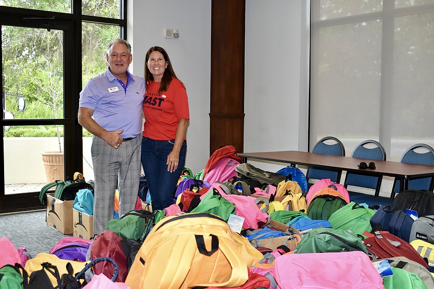 Jon Mast, CEO of the Suncoast Builders Association, and his wife Teresa Mast attend Stuff the Backpack on July 11 at Gold Coast Eagle Distributing.