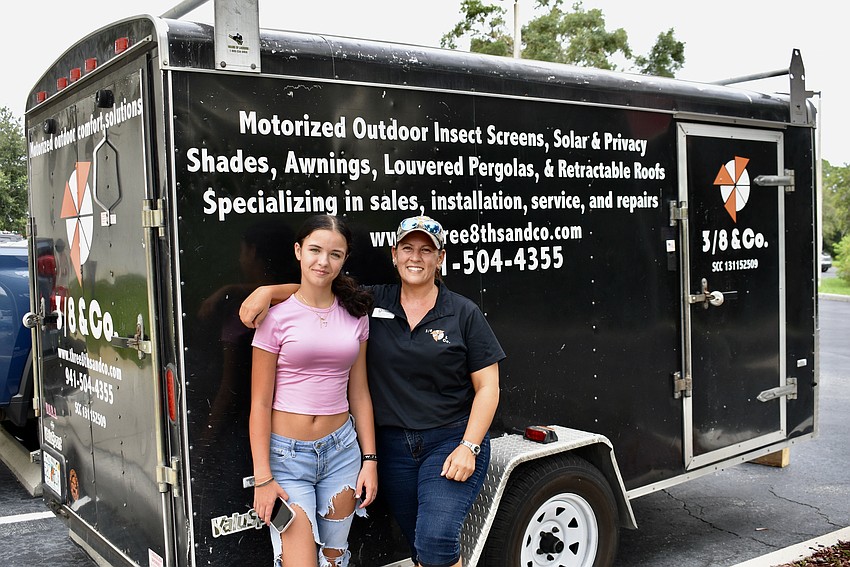 Julia Tamburin and Kim Boynton, Sarasota residents and mom and daughter, transport the 528 backpacks and supplies to the event in the back of Boynton's work trailer.