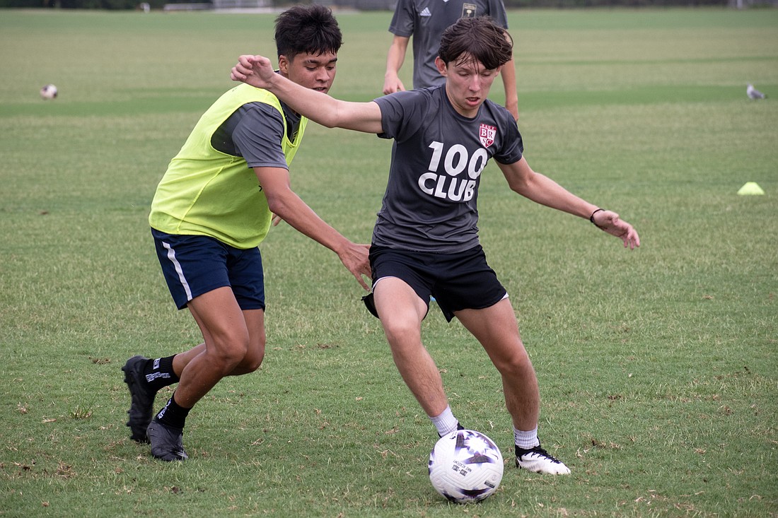 Artem Kopmar, a captain of the Braden River Soccer Club U16 boys team, dribbles around Davi Pereira at a team practice.