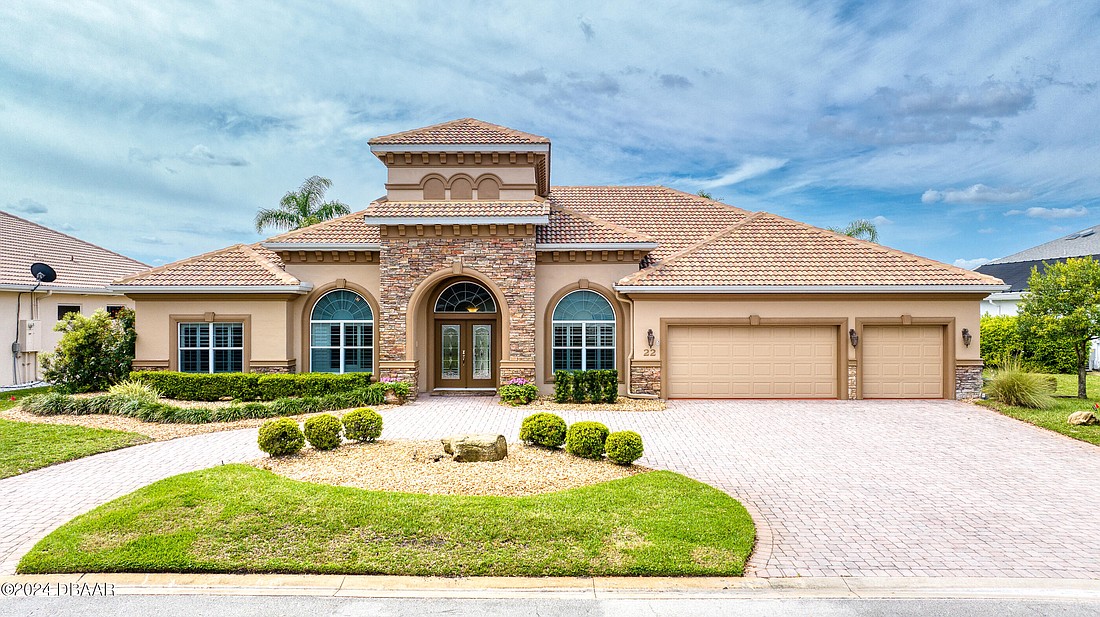 The lakefront house is a 4/3 and has one fireplace, a pool and 3,209 square feet. Photo courtesy of Jonathan Gildon/Gildon Group