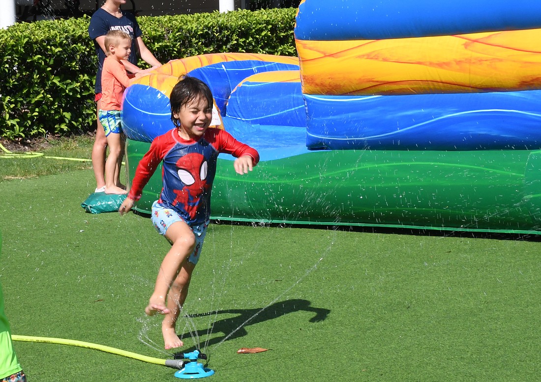 Alexander Osmarq had a blast running through the sprinklers during camp.