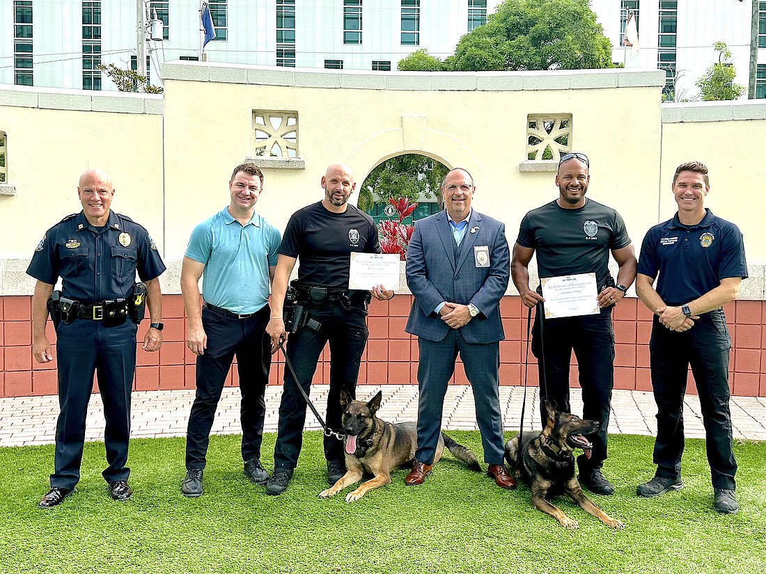 From left, Capt. Demetri Konstantopoulos, Cory McDonnell  of Grassroots K9 Sarasota, Officer Jake Nelson, K9 Brody, Chief Rex Troche, K9 Bruin, Officer Adam Bearden and Lt. Dwayne Shellhammer.