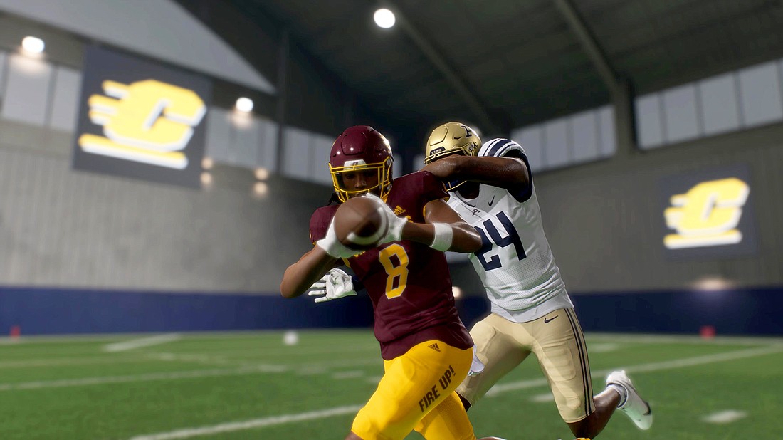 A digital version of Booker High alum Josiah Booker (8) snags a pass for Central Michigan University in front of a University of Akron defender in "College Football 25." Booker is a freshman wide receiver at CMU.