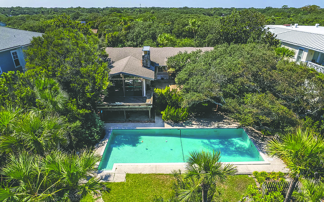 Oceanfront single-story home built in 1966 features four bedrooms, four bathrooms, pool and deck.