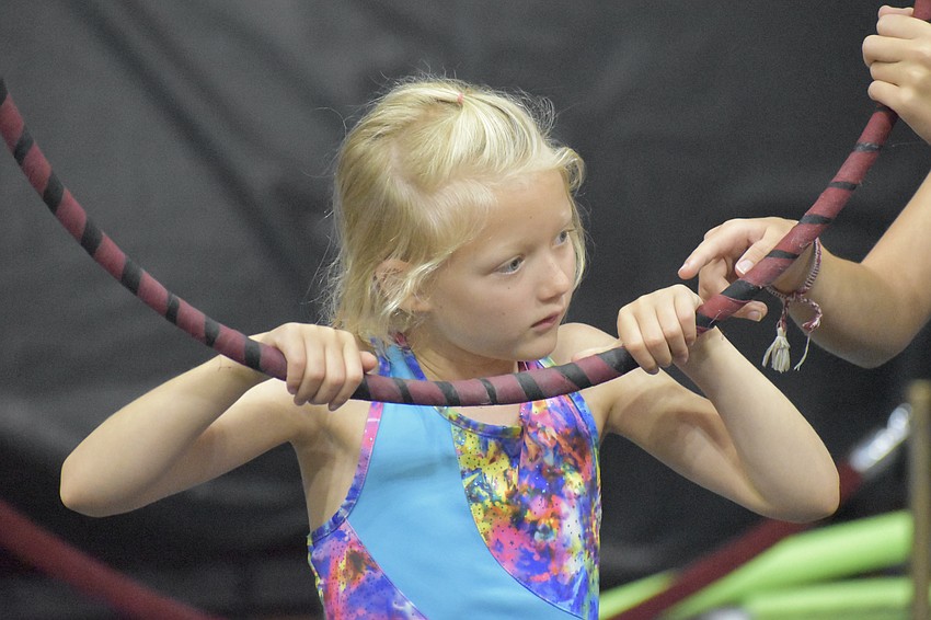 Camper Bailey Batten, 8, prepares to enter the lyra.