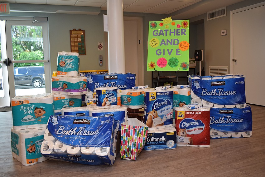 At its July charity happy hour, Longboat Island Chapel collected toilet paper for Stillpoint Mission.