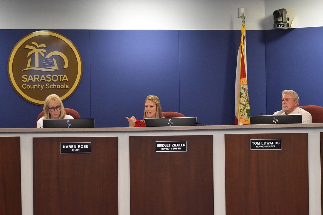 Sarasota School Board member Bridget Ziegler, between Chair Karen Rose and member Tom Edwards, speaks at the July 18 meeting.