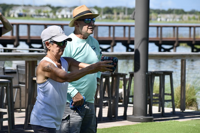 Lakewood Ranch residents Joann and Steve Saladino play cornhole every week at Waterside Place.