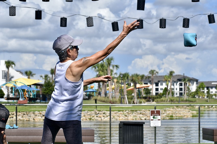 Joann Saladino is fully focused as she tosses a beanbag across The Yard.